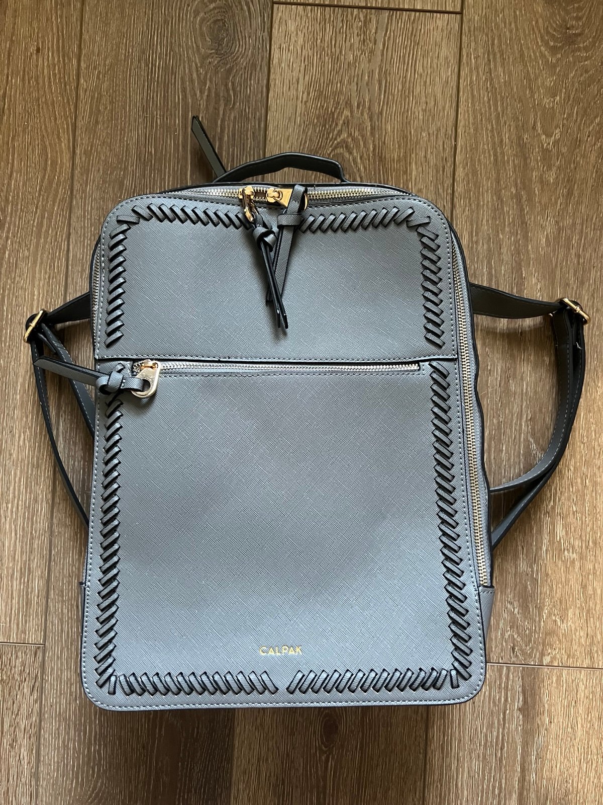 Brand new Calpak back pack gray in color
