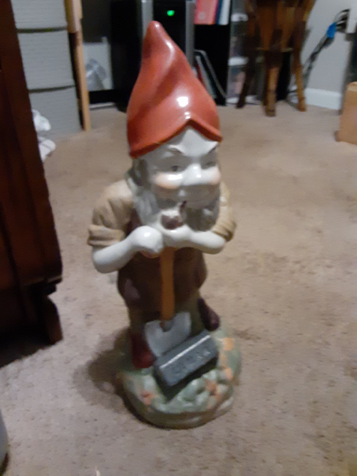 A one and a half foot tall garden gnome