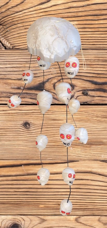 Vintage Gemmy Halloween skull wind chime animated sound bones decor