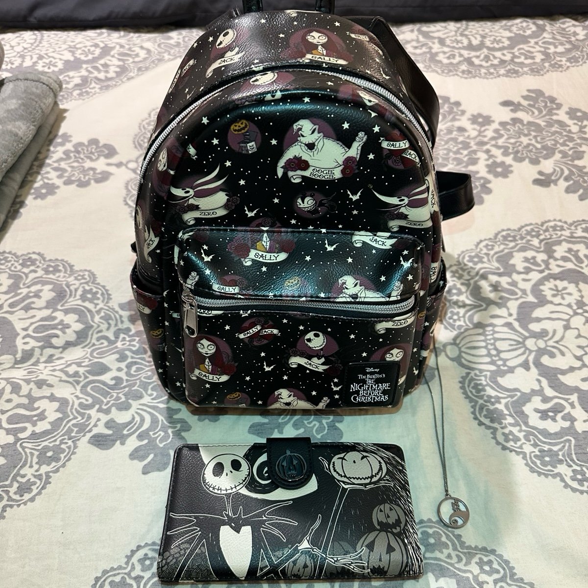 The Nightmare Before Christmas Loungefly Backpack & Wallet with a necklace