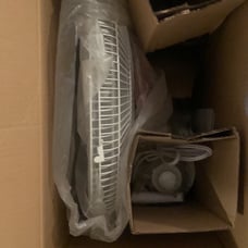 One new in box wall mounted fan with remote