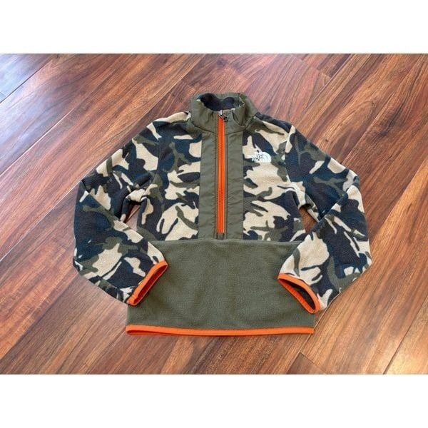 The North Face Printed Glacier 1/4 Zip green camo fleece sweatshirt.