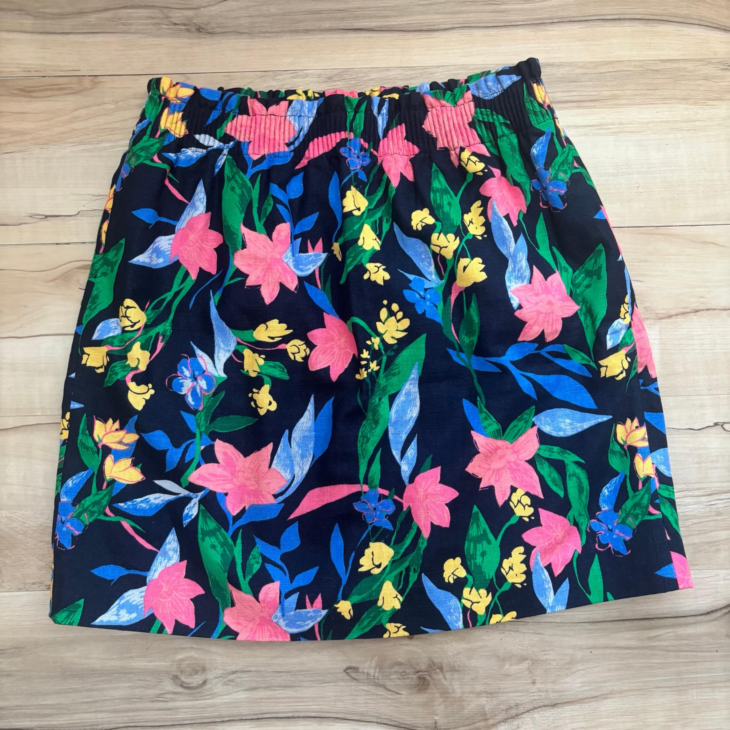 This J. Crew skirt showcases a playful floral print with pink and blue hues, per