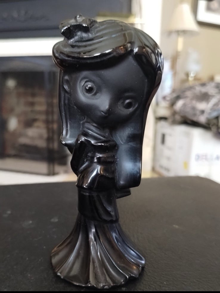 Black obsidian girl carving