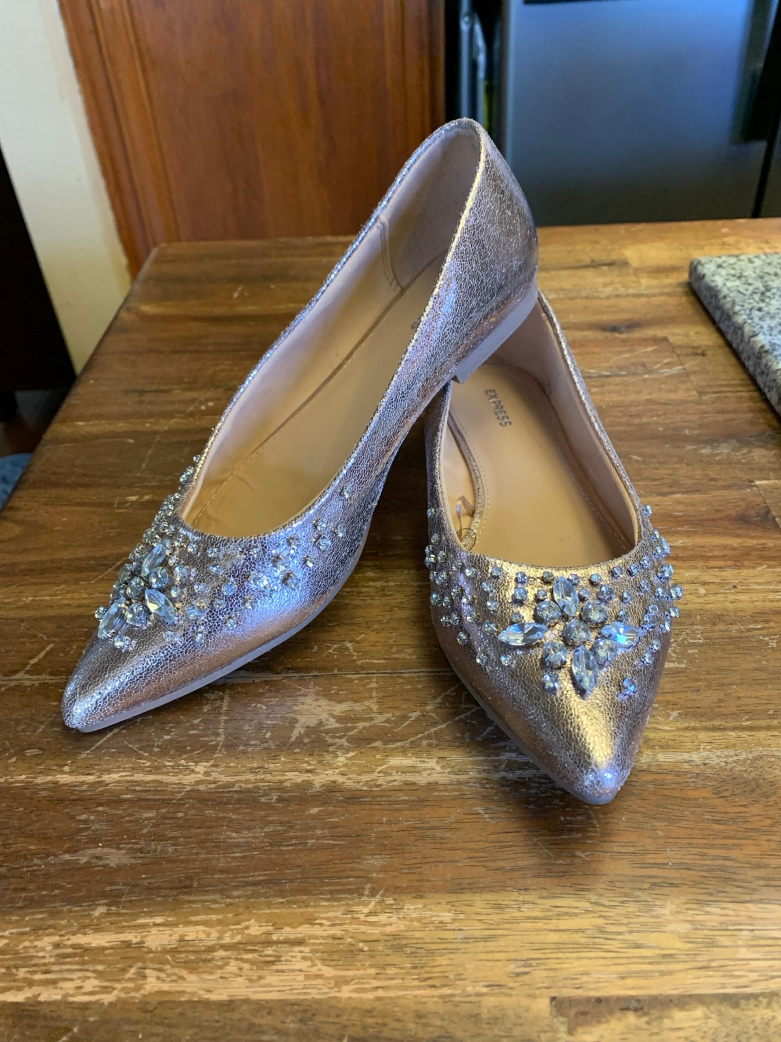 Women’s express gold and rhinestone slippers