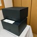 Two VALEXTRA bags and two Careguard envelopes.