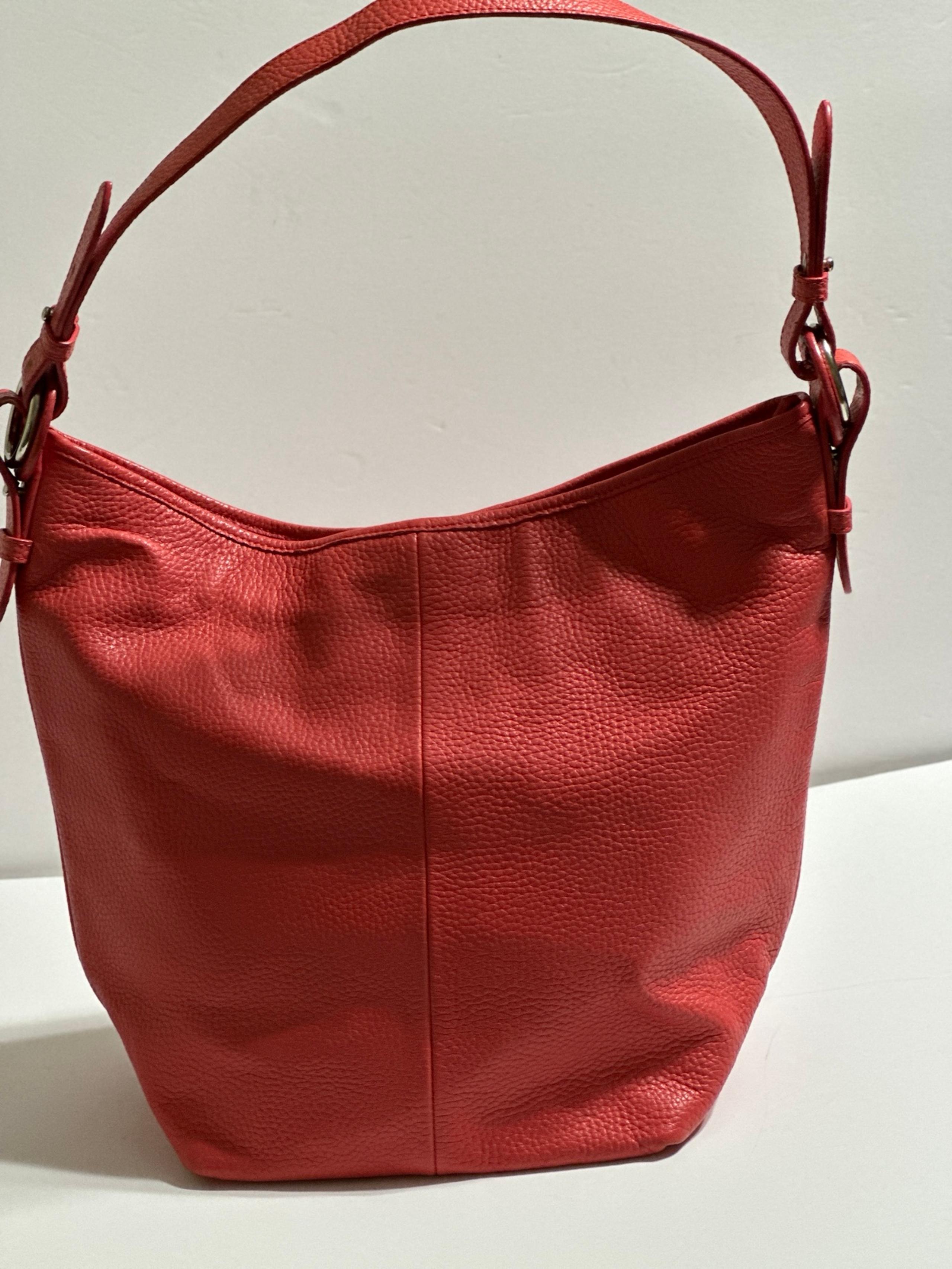 Coral leather shoulder bag by Coldwater Creek.