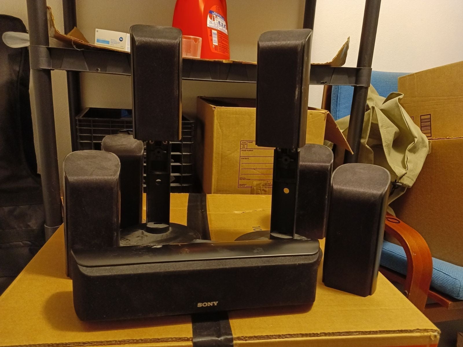Speakers with wall mounts and cable.