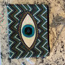 Evil eye purse America and beyond