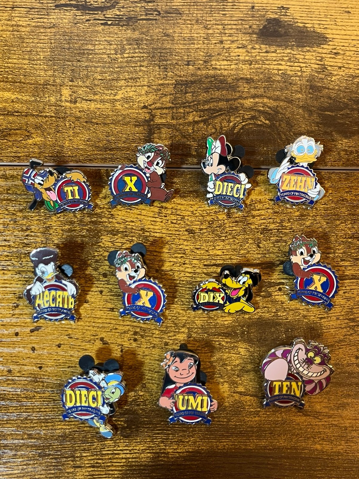 Ten years of pin trading various languages 2009 11 piece bundle