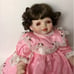 Beautiful doll in pink lace dress Signed Vintage