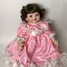 Beautiful doll in pink lace dress Signed Vintage