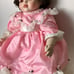 Beautiful doll in pink lace dress Signed Vintage