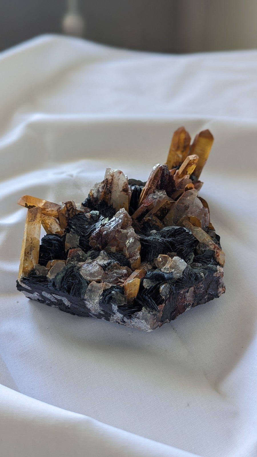 Tangerine quartz crystal with hematite roses