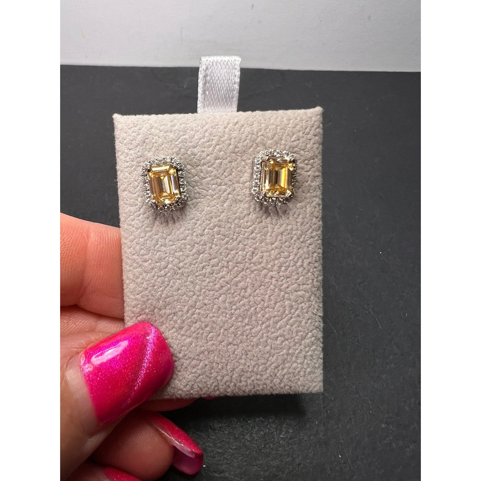 Yellow and white moissanite halo stud earrings in rhodium over sterling silver