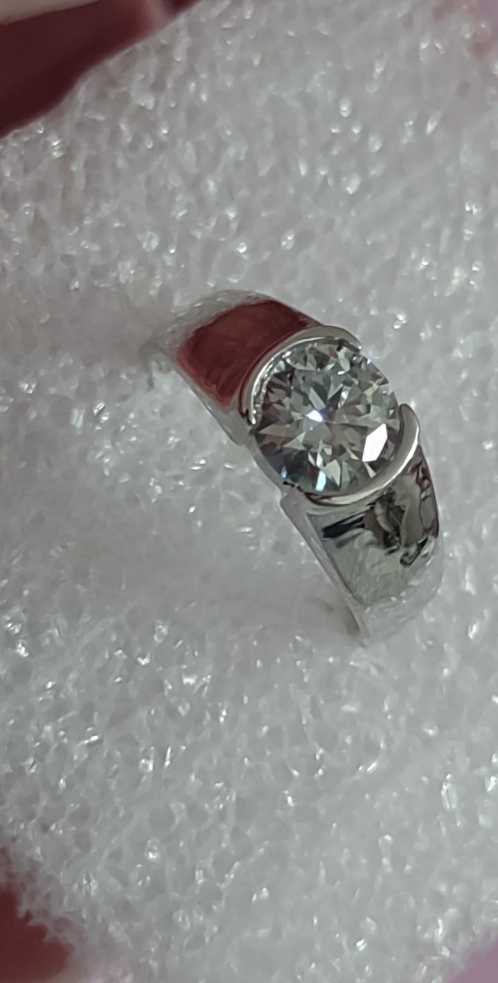 Size 7 bezel set 1 carat diamond solitary and 925 Sterling wedding band.
