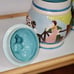 Cookie Jar German Scene Turquoise Aqua w/Pitcher Man Sitting on Log Rare Vintage