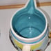 Cookie Jar German Scene Turquoise Aqua w/Pitcher Man Sitting on Log Rare Vintage