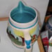 Cookie Jar German Scene Turquoise Aqua w/Pitcher Man Sitting on Log Rare Vintage
