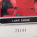 2022-23 LUKE SHAW PANINI OBSIDIAN JERSEY AUTO RED PULSAR 23/44