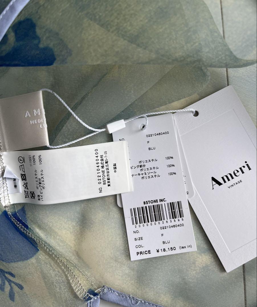 Ameri（アメリ）の「MEDI ROLLER ART SHEER TOP（シャツ