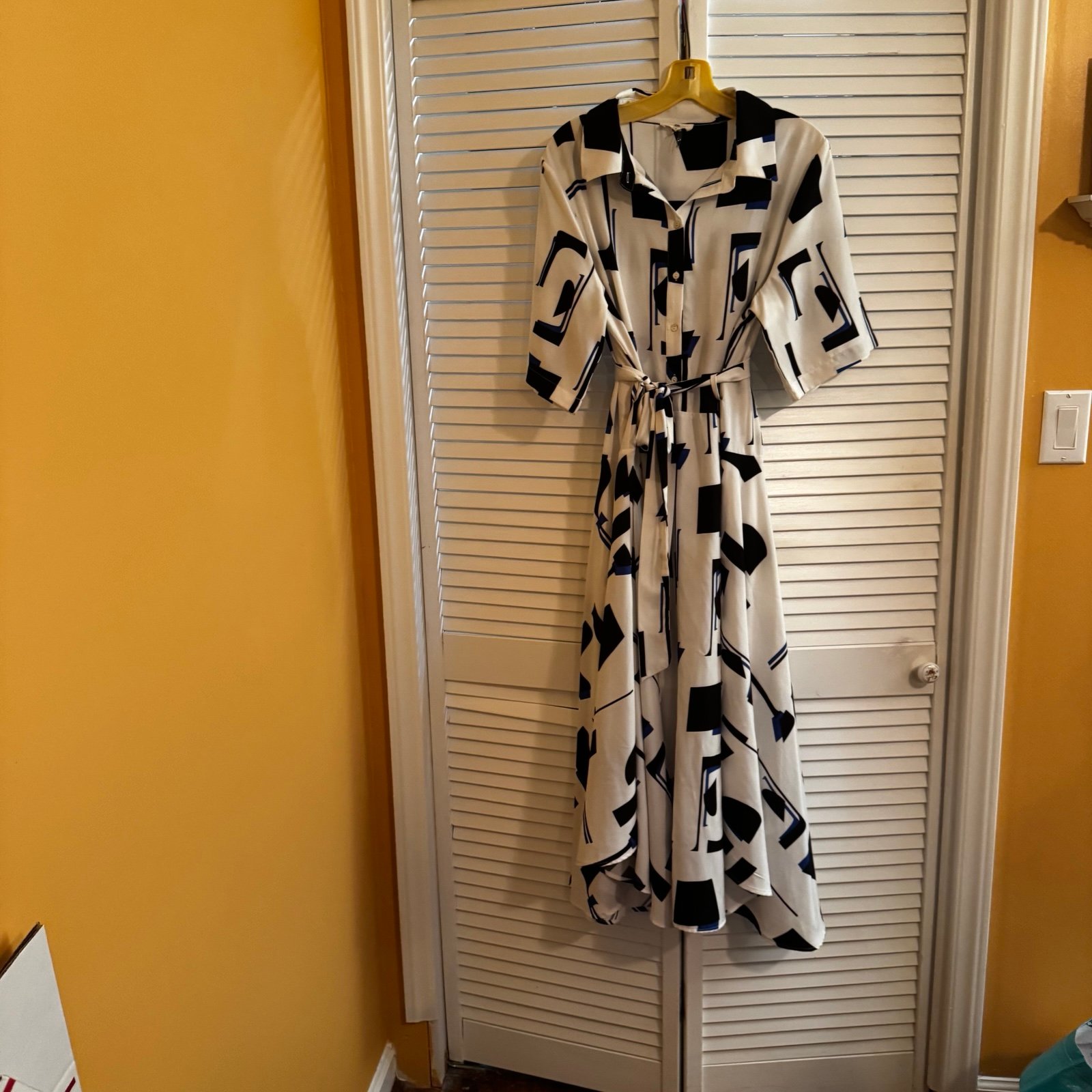 Black and white lined to hip area, short sleeves size Large