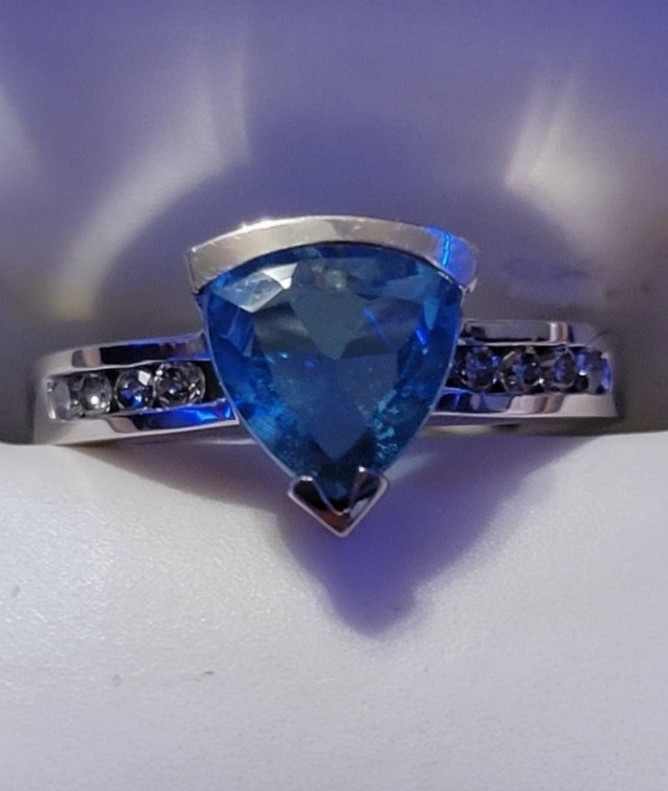 Blue topaz and diamond ring