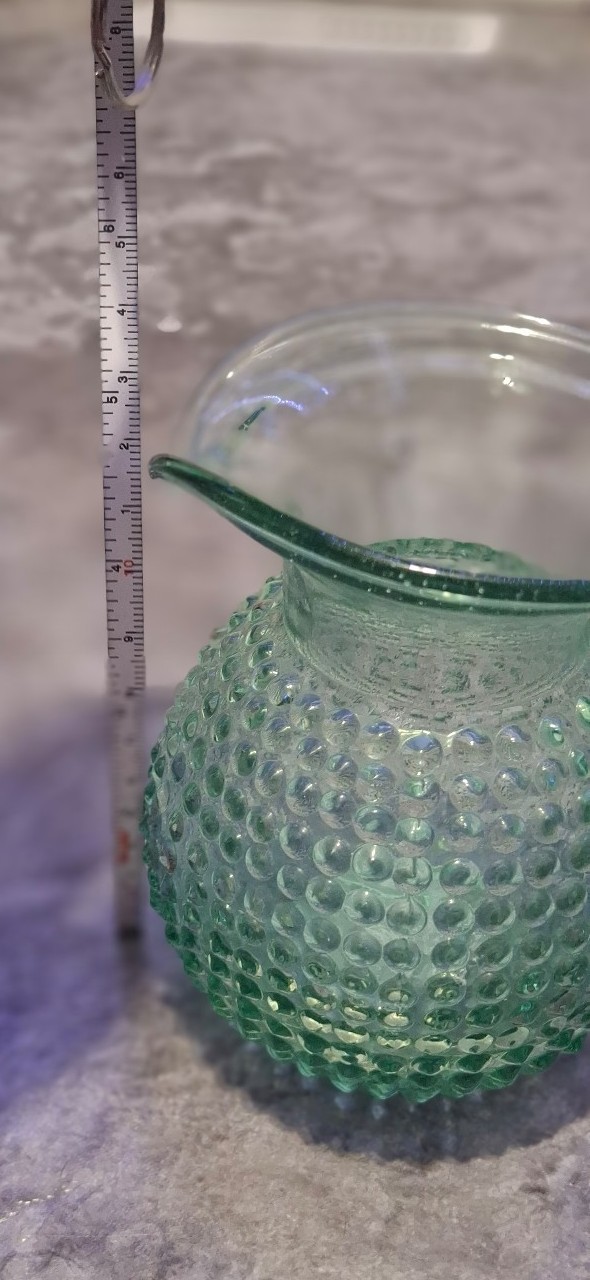 light green vintage fenton raisd bubbles pitcher.