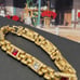 #1137, 10K GP BRACELET, Cz DIA, & GARNET STONE, 7.5 INCHES