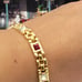 #1137, 10K GP BRACELET, Cz DIA, & GARNET STONE, 7.5 INCHES