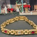 #1137, 10K GP BRACELET, Cz DIA, & GARNET STONE, 7.5 INCHES