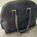 Dooney and Bourke Black Pebble Leather Bowling Bag