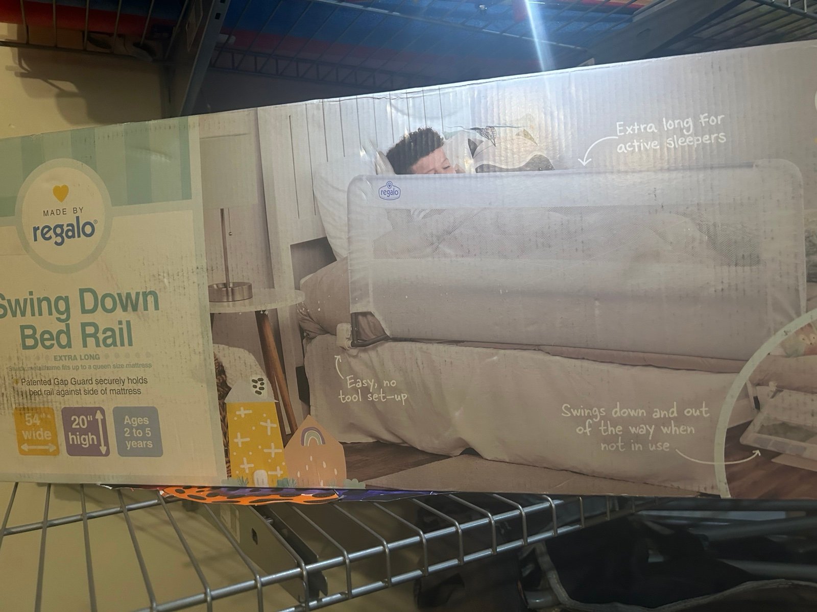 Swing down bed rail