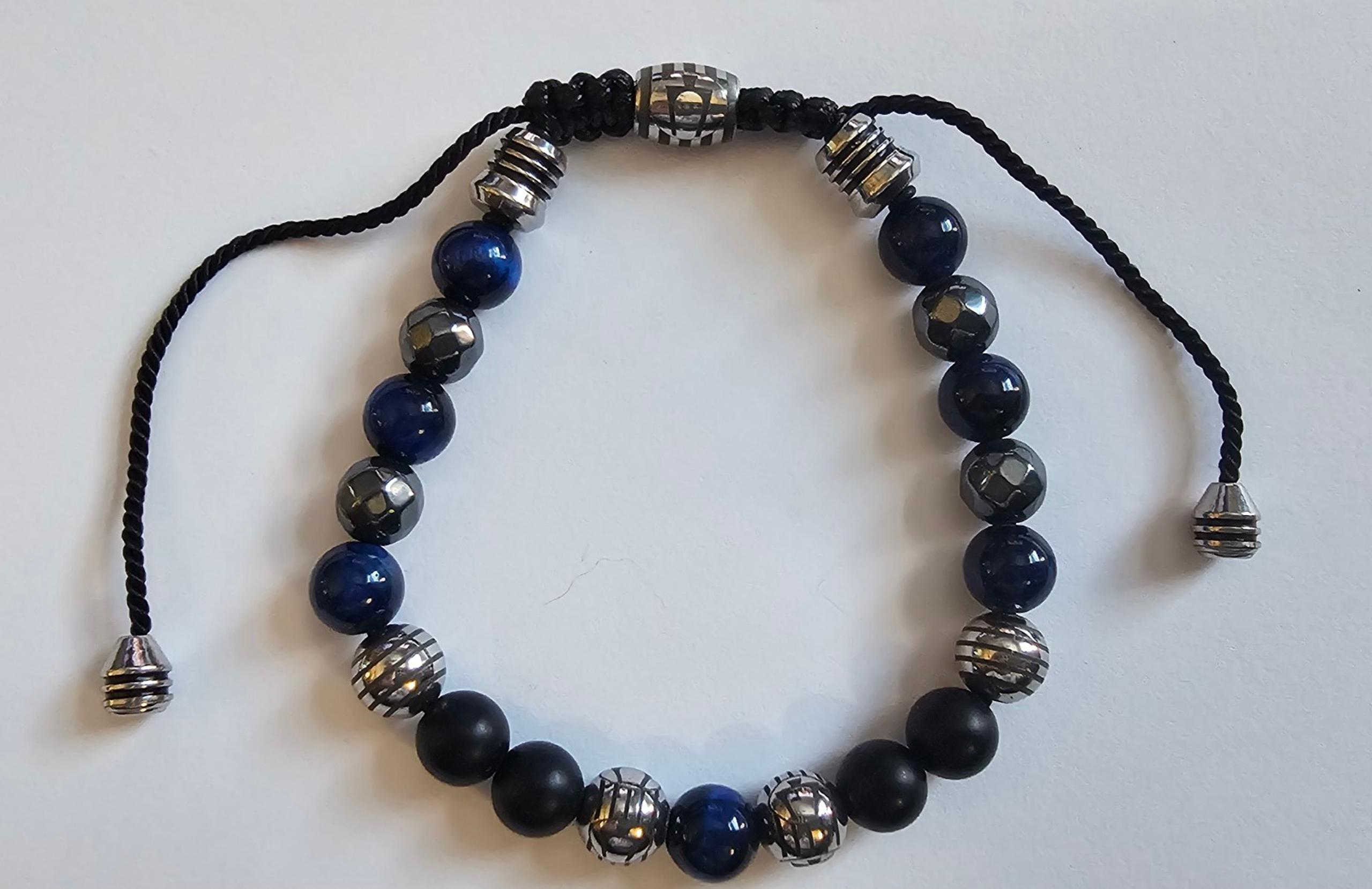 Unisex adjustable beaded bracelet with Bulova logo. Heavy and solid!