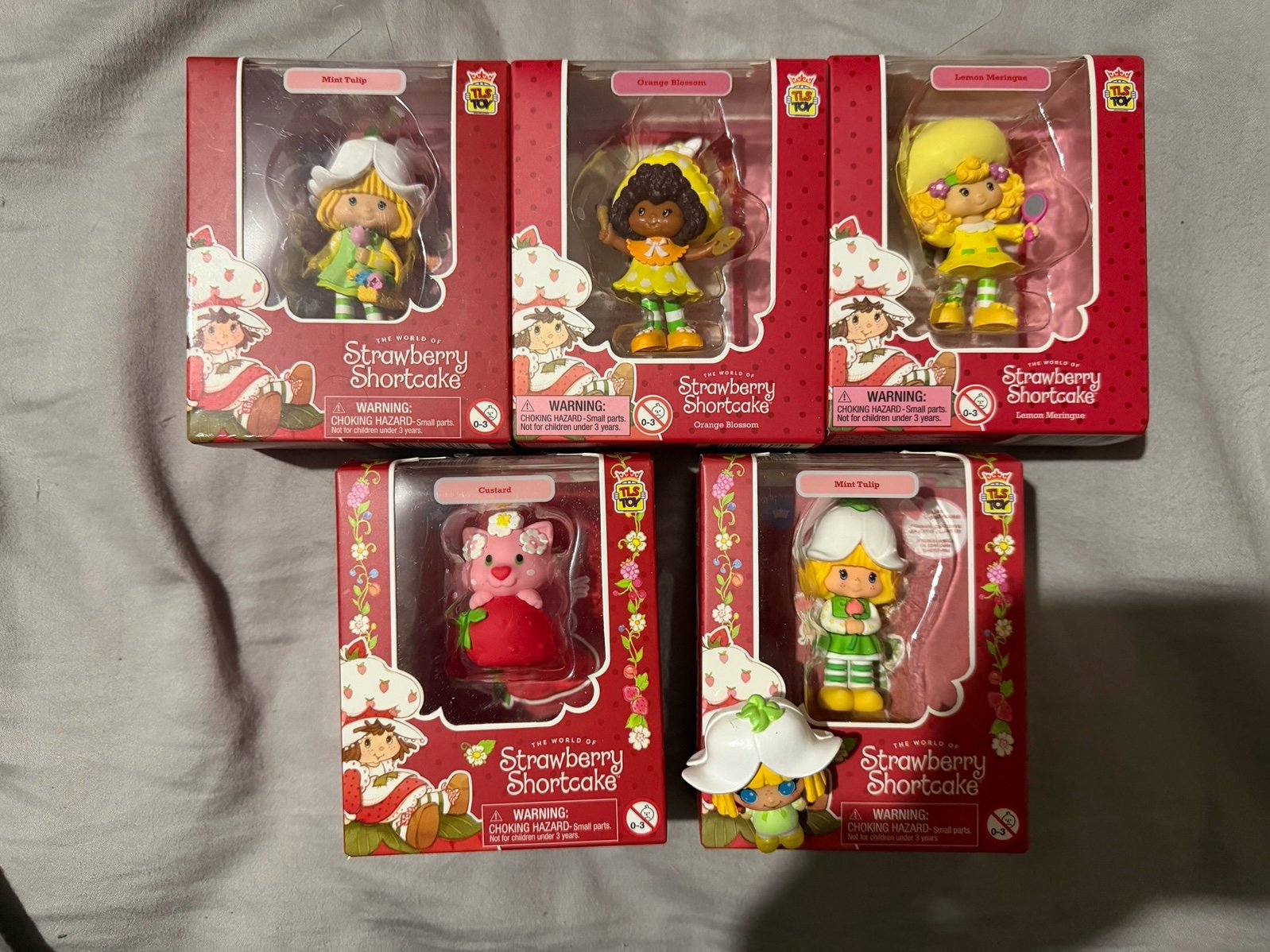 7 Strawberry Shortcake figures and 4 Rainbow Brite Lot