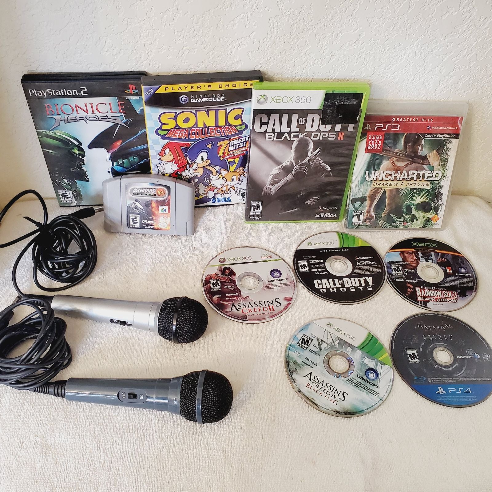 Reseller's Mixed Game Lot Nintendo 64 Xbox 360 PlayStation 4 3 & 2 GameCube Mic