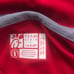 A red chick fil a polo