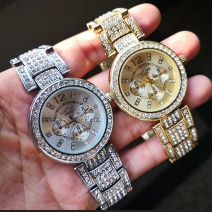 Gold watch with 2.2 carat diamonds in them that is for male and female
