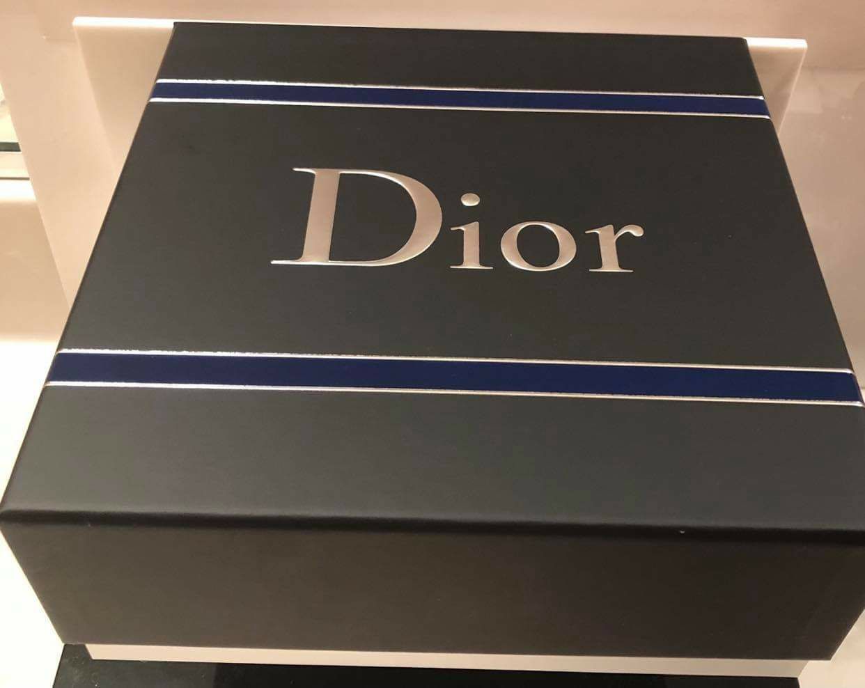 Dior gift box and a shopping bag