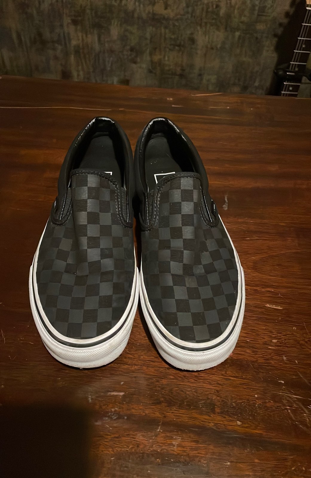 Checkered Vans slip ons