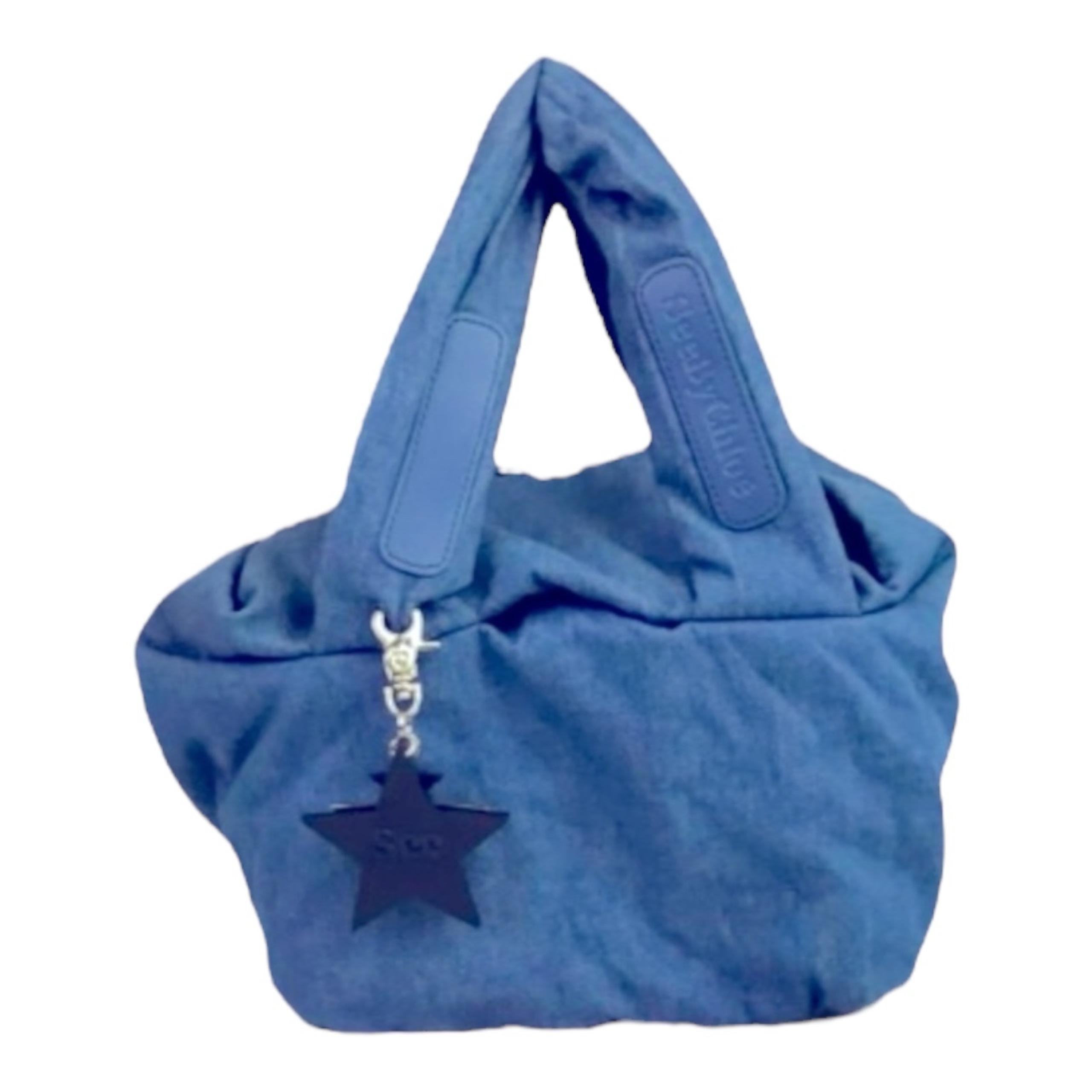 See by Chloe blue denim bag with star charm attached