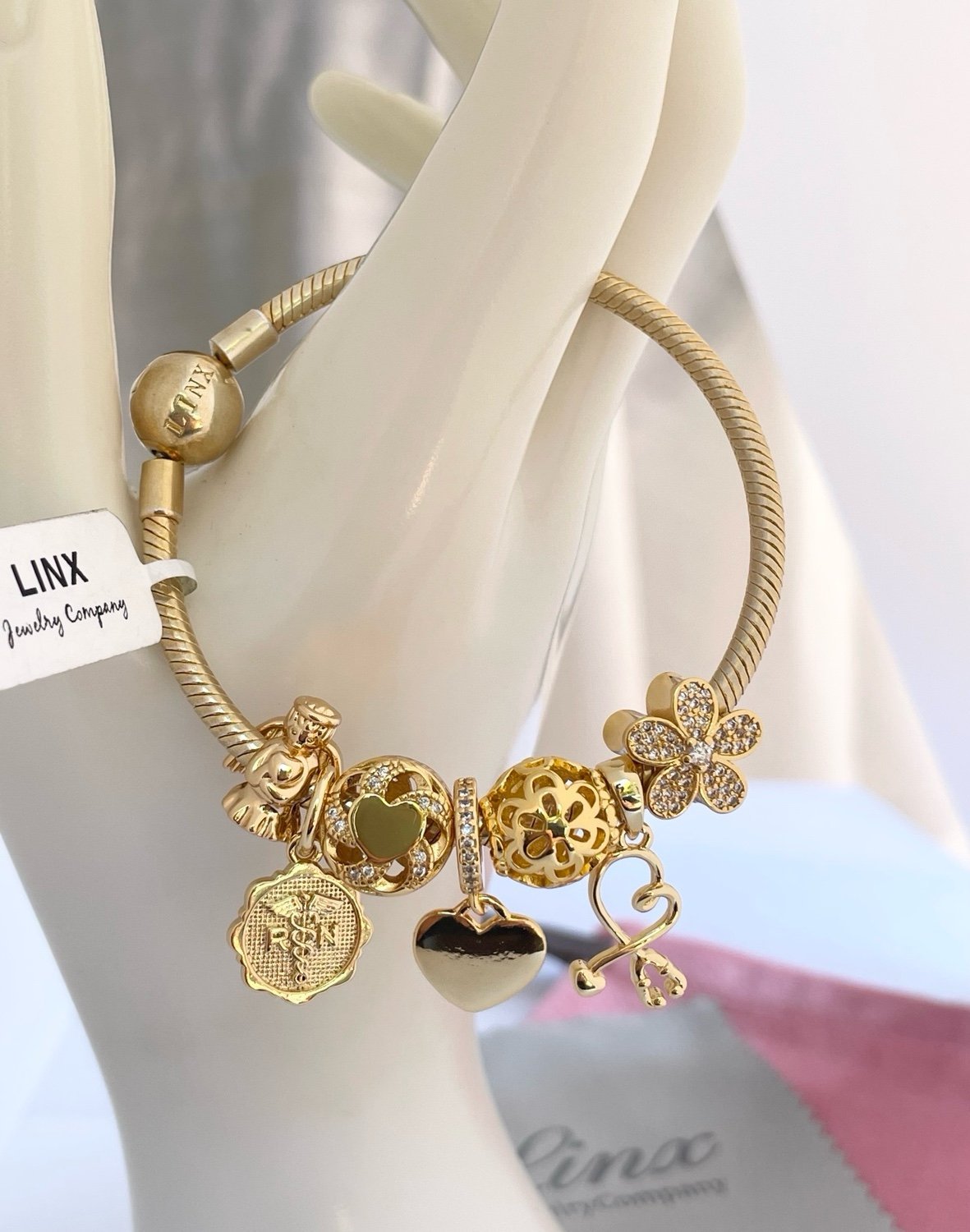Linx Yellow Gold Snake Chain Bracelet with Registered Nurse Themed Charms