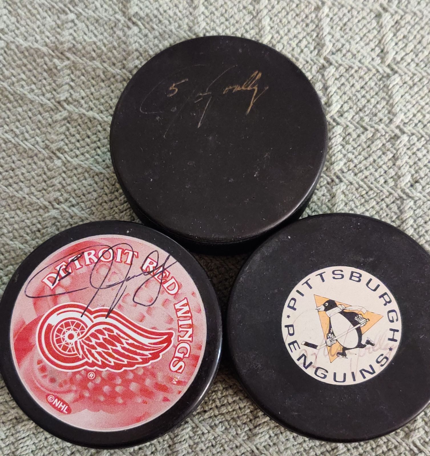 Jason Woolley autographed pucks
