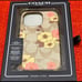Coach iphone14 pro case in signature canvas with floral print