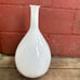 Tall white art glass vase with brown splatter 17”