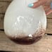 Tall white art glass vase with brown splatter 17”