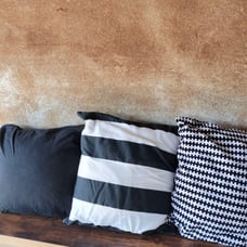 Set of 3 black and white striped cushions.
