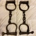 Vintage Two Numbered Cast Iron Handcuffs