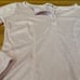 Intimately Free People long sleeve light pink Henley Sloan bodysuit.
