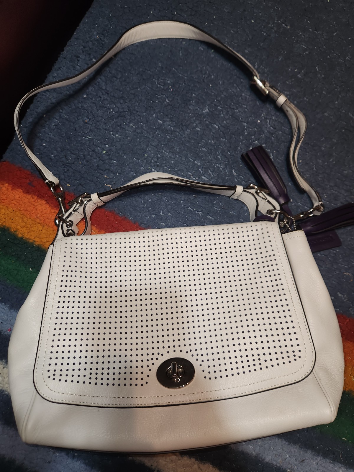 Coach purse with purple tassles